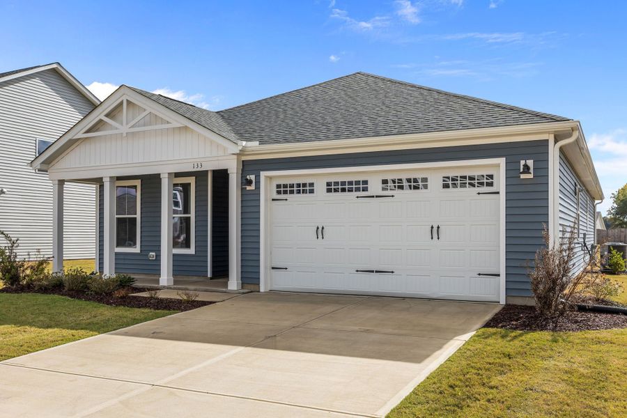 Front exterior of a home in the The Farm at Neill's Creek community, located in Lillington, NC (Image 3).
