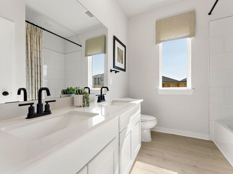 Furnished interior in a model home at Sundance Cove in Crosby (Image 27).