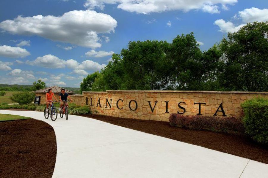 Main entrance to the Blanco Vista master-planned community in San Marcos, TX, featuring its landmark signage (Image 1).