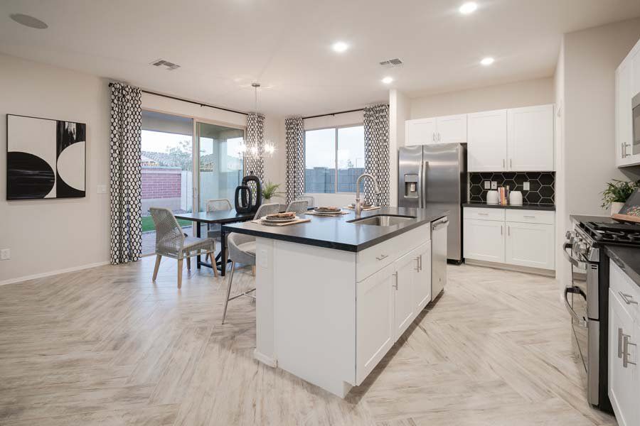 Furnished interior in a model home at Beacon Hill at Marley Park in Surprise (Image 43).