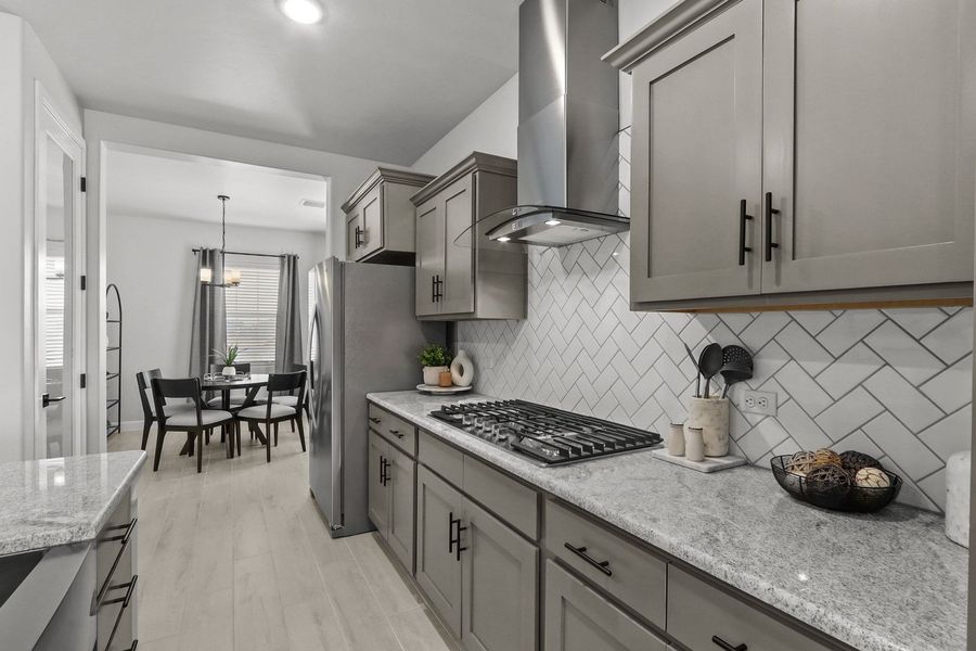 Furnished interior in a model home at Paseo Del Este in El Paso (Image 9).