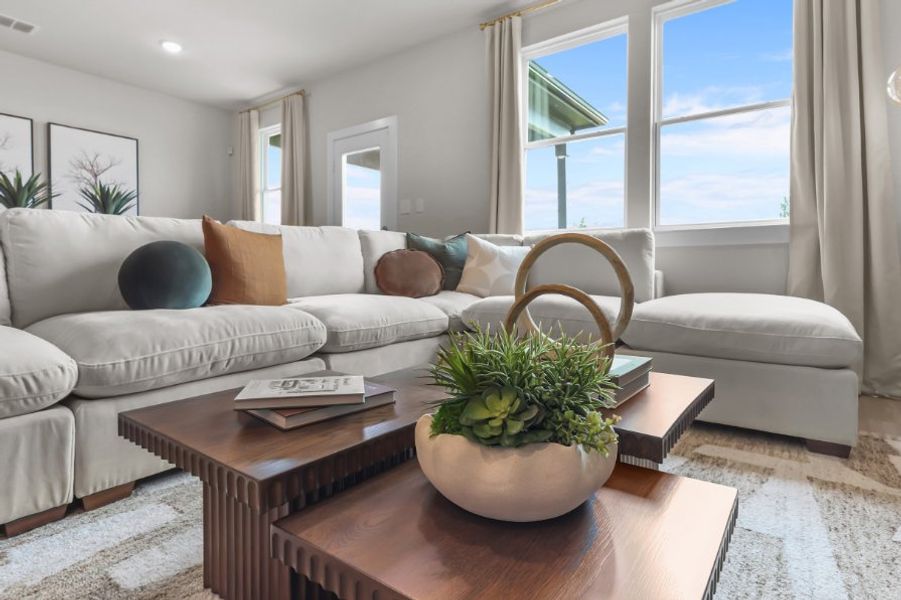 A living room with a large window. A living room with a large window.