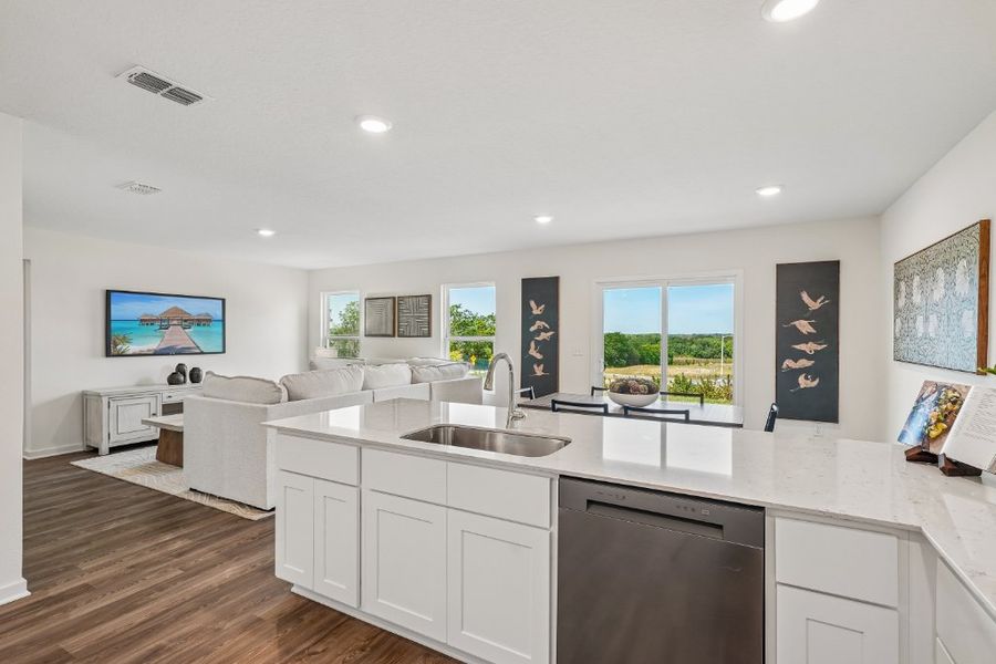 A kitchen with white cabinets. A kitchen with white cabinets.