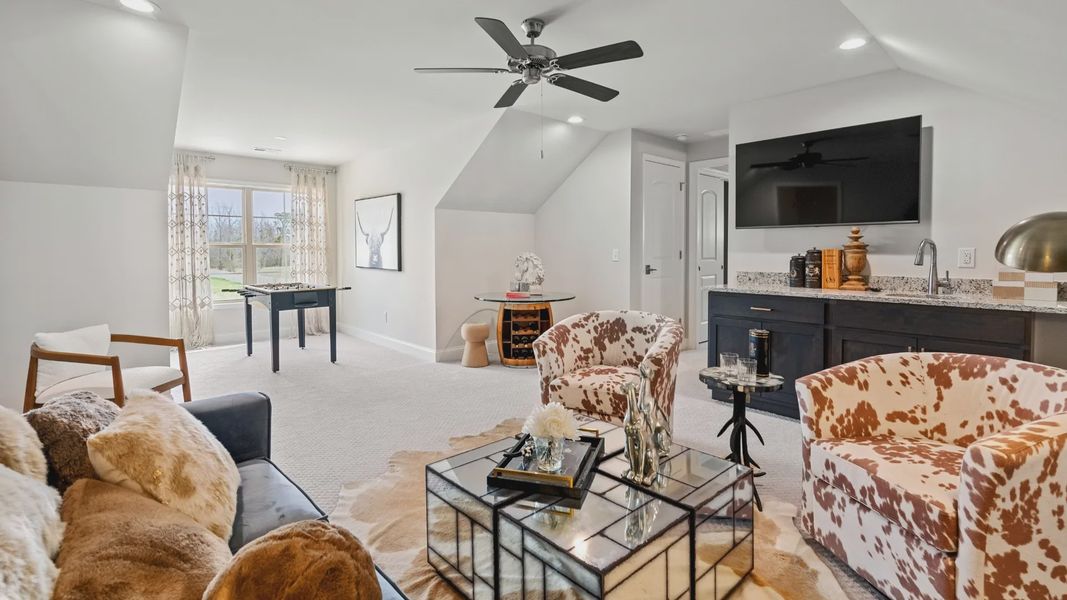 Furnished interior in a model home at Courtyards by Carrell in Ocean Isle Beach (Image 8).