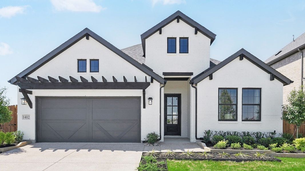 Elegant gabled facade with striking black accents in Green Oaks Preserve. Elegant gabled facade with striking black accents in Green Oaks Preserve.