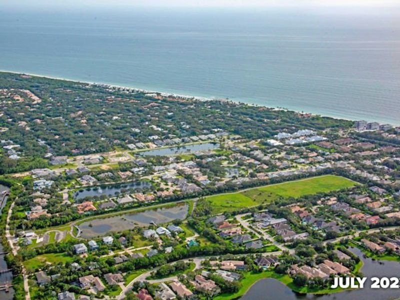 Aerial view of the The Strand community in Vero Beach, FL, showing layout and nearby surroundings (Image 20).