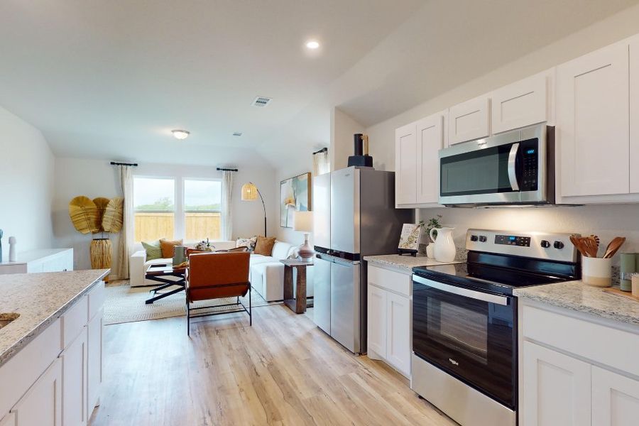 A kitchen with white cabinets. A kitchen with white cabinets.