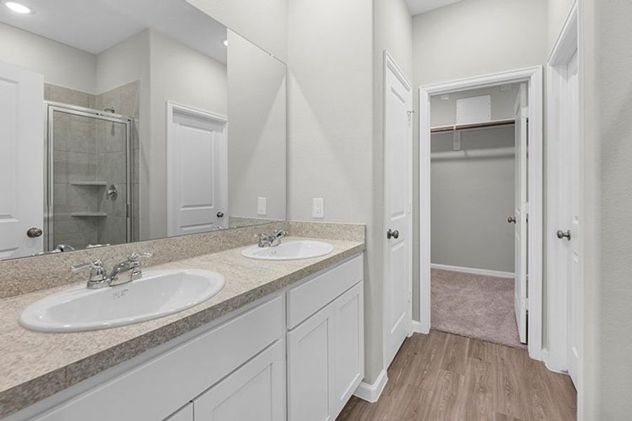 A bathroom with a marble countertop.