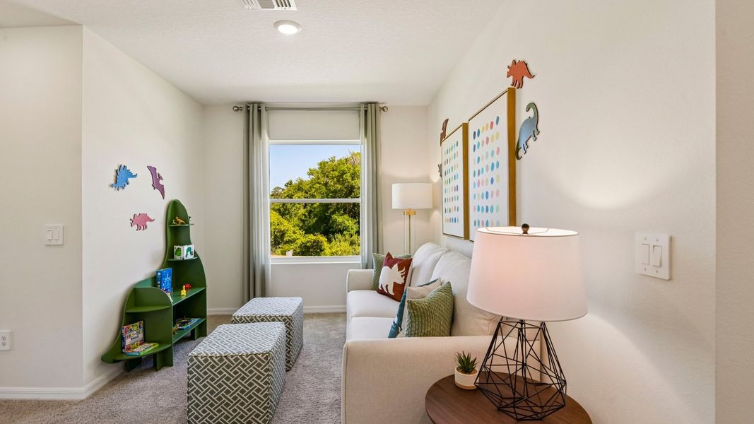 Furnished interior in a model home at Sanctuary at Citrus Park Townhomes in Tampa (Image 18).