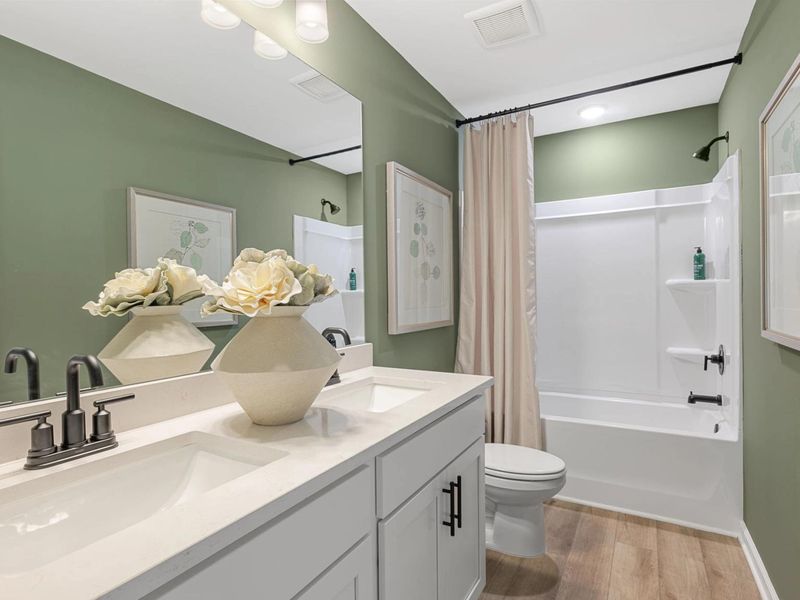 Furnished interior in a model home at The Bluffs in Canton (Image 17).