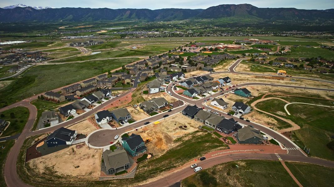 Aerial view of the Cloverleaf - Pinnacle Collection community in Monument, CO, showing layout and nearby surroundings (Image 9).