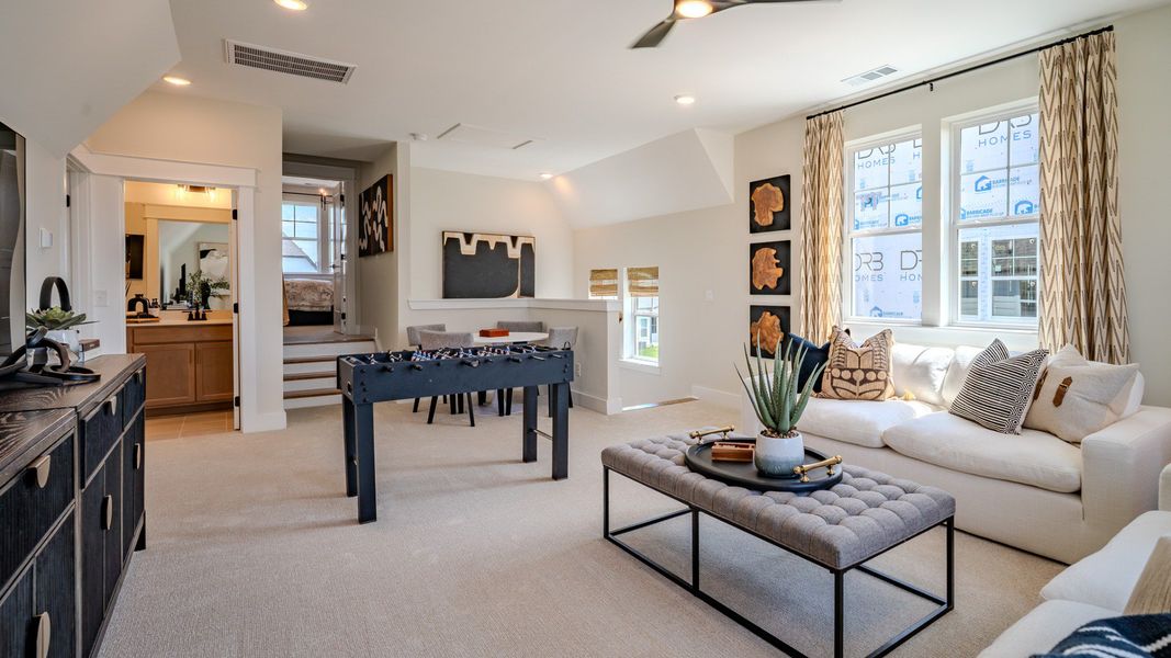 Bonus room with carpet flooring and plenty windows