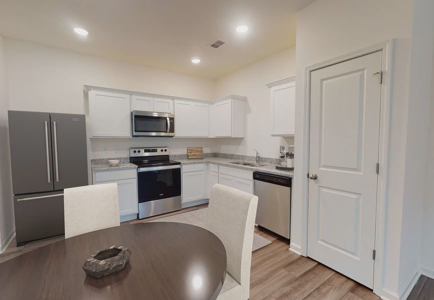 Furnished interior in a model home at Clinton Townhomes in Dade City (Image 4).