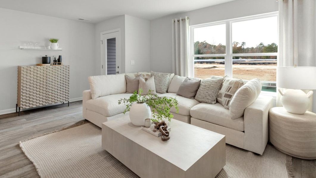 Furnished interior in a model home at Waterside Townhomes in Surf City (Image 13).