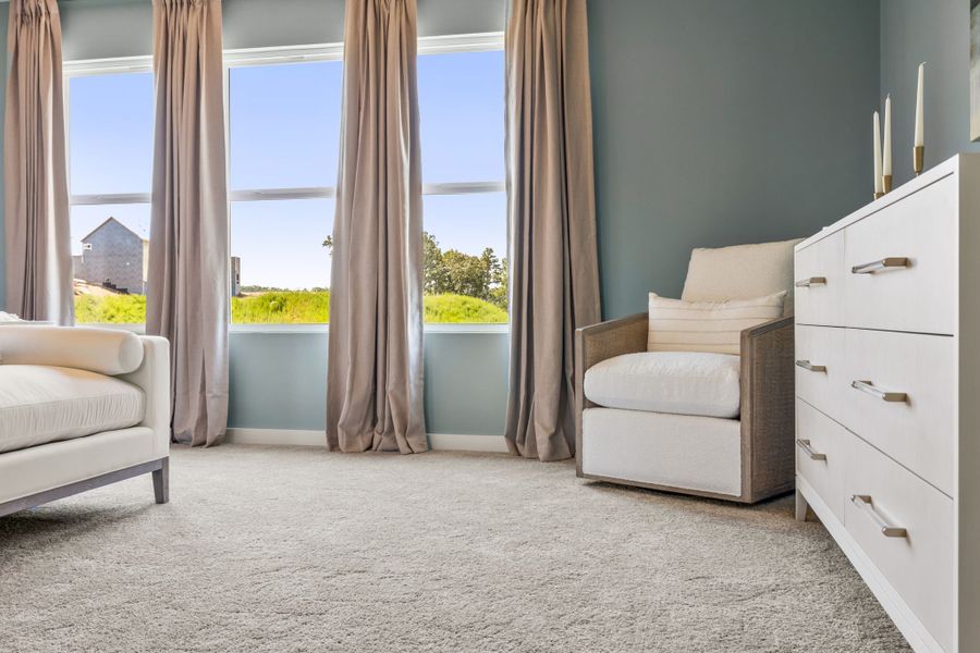 A room with a bed and a window.