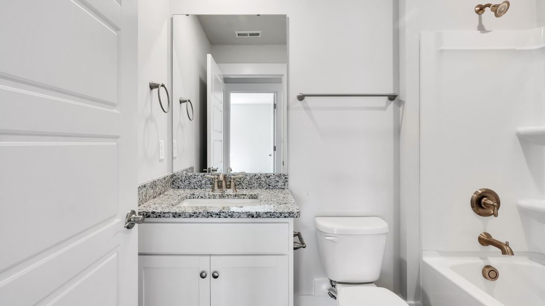 Furnished interior in a model home at The Pines at Blake Farm in Wilmington (Image 33).