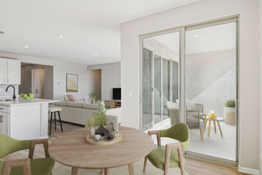 Furnished interior in a model home at Stonebridge Manor in Waddell (Image 5).