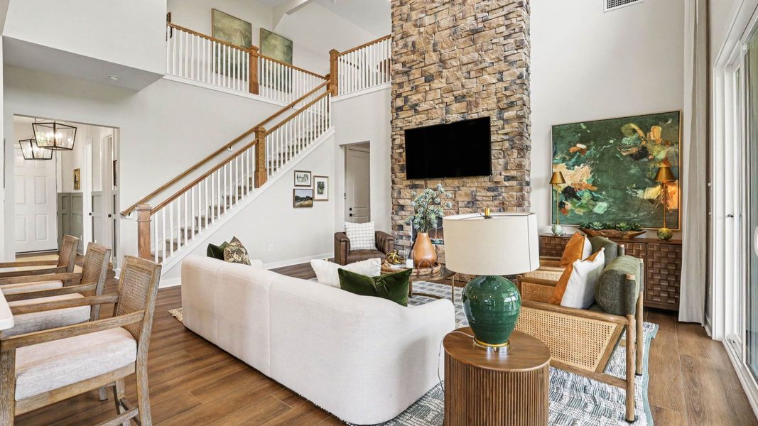 Gathering room with high ceilings and stone fireplace Gathering room with high ceilings and stone fireplace