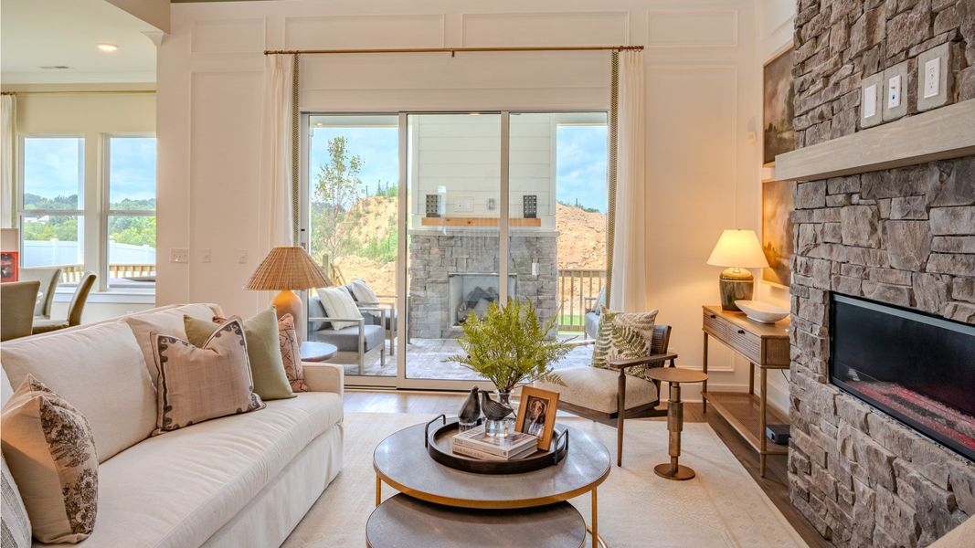 Cozy gathering room with stone fireplace, perfect for winding down at the end of the day Cozy gathering room with stone fireplace, perfect for winding down at the end of the day