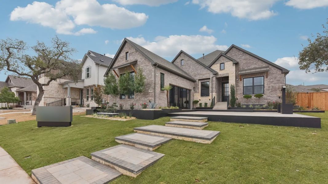 Front exterior of a home in the Parkside on the River community, located in Georgetown, TX (Image 5).