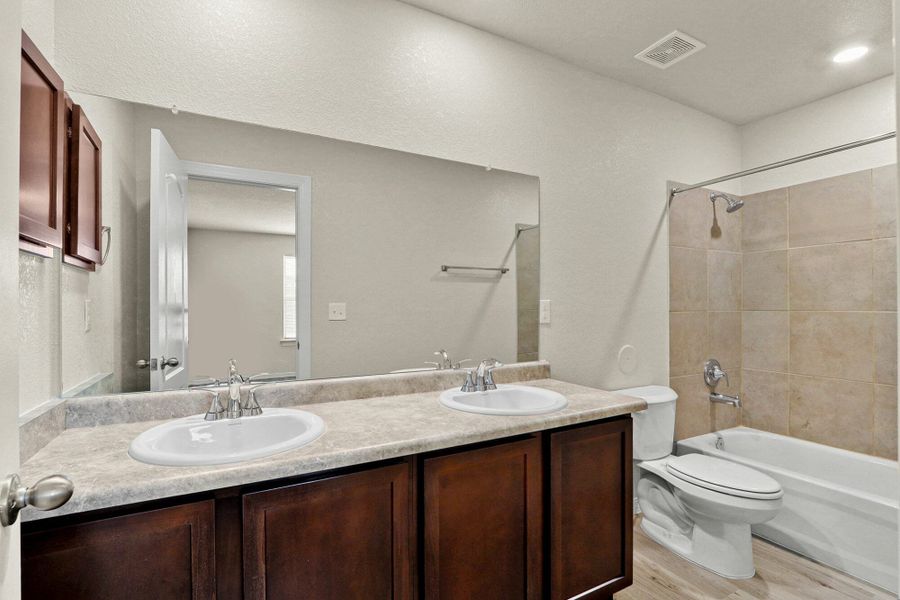 Furnished interior in a model home at Rancho Desierto Bello in Horizon City (Image 6).