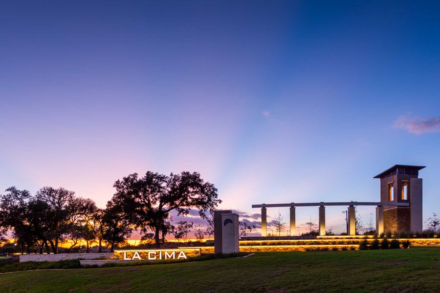 Entrance to the La Cima: 50ft. lots community in San Marcos, TX, featuring signage and landscaping (Image 12). Entrance to the La Cima: 50ft. lots community in San Marcos, TX, featuring signage and landscaping (Image 12).