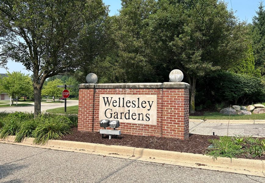Entrance to the Wellesley Woods community in Ypsilanti, MI, featuring signage and landscaping (Image 1). Entrance to the Wellesley Woods community in Ypsilanti, MI, featuring signage and landscaping (Image 1).