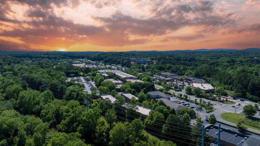 Aerial view of the Canton Overlook Townhomes community in Canton, GA, showing layout and nearby surroundings (Image 1). Aerial view of the Canton Overlook Townhomes community in Canton, GA, showing layout and nearby surroundings (Image 1).