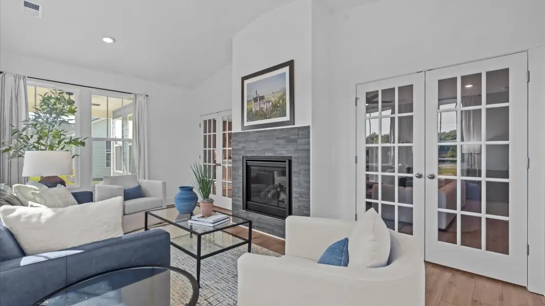 The electric fireplace brings warmth and character to this thoughtfully designed morning room in SC