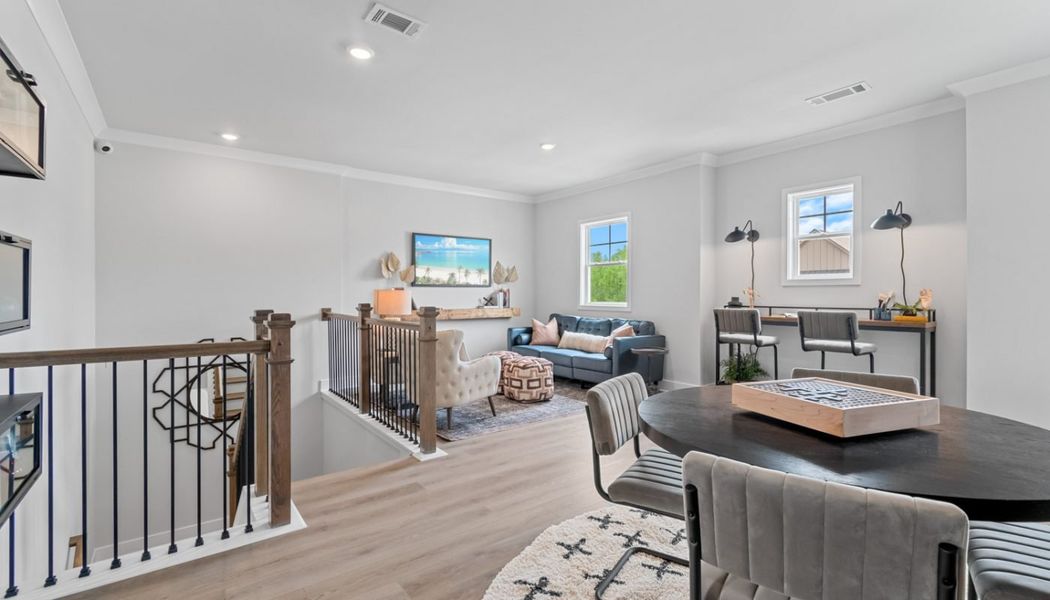 Furnished interior in a model home at Summerlin in Winder (Image 39).