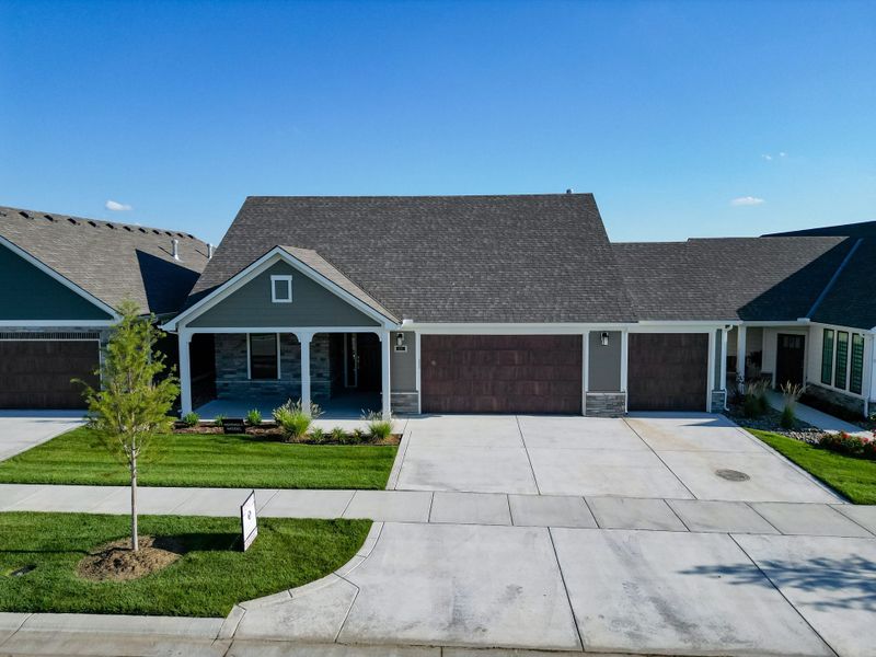 Front exterior of a home in the The Courtyards at The Heritage community, located in Andover, KS (Image 6). Front exterior of a home in the The Courtyards at The Heritage community, located in Andover, KS (Image 6).