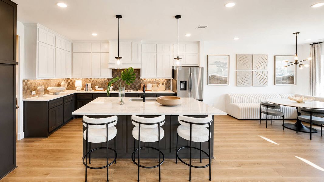 Furnished interior in a model home at Spiritas Ranch in Little Elm (Image 4).