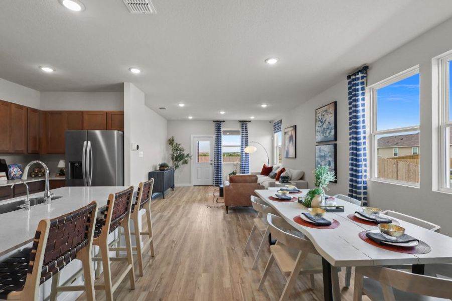 A kitchen with a dining table.