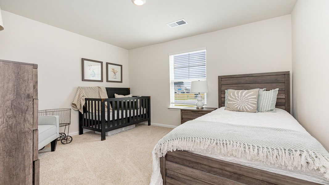 Furnished interior in a model home at Silver Oaks in Ocean Isle Beach (Image 3).