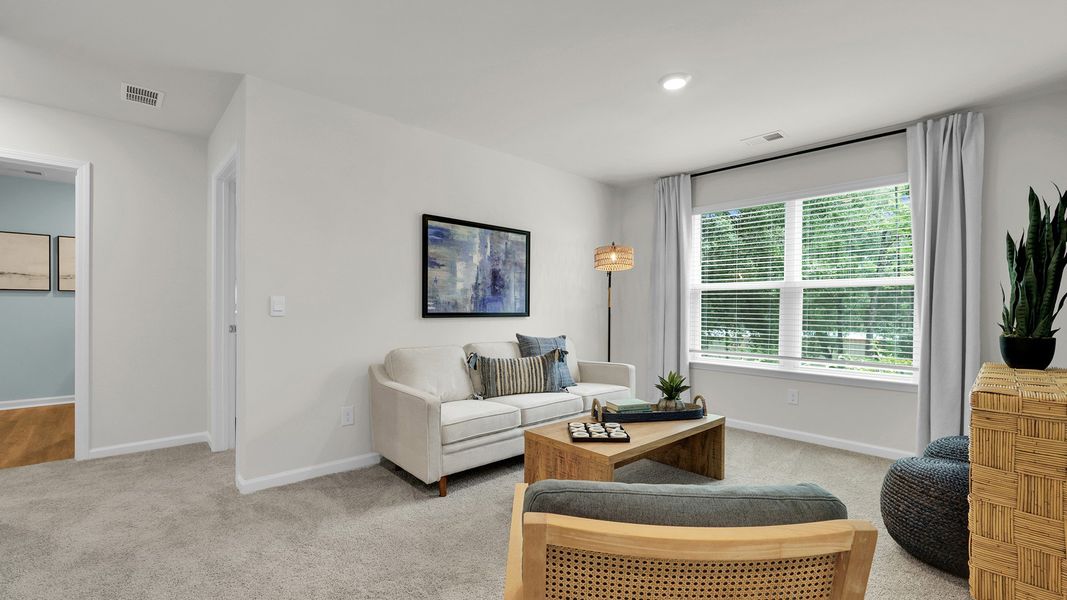 Furnished interior in a model home at The Cove at Mallard Crossing in Summerville (Image 22).