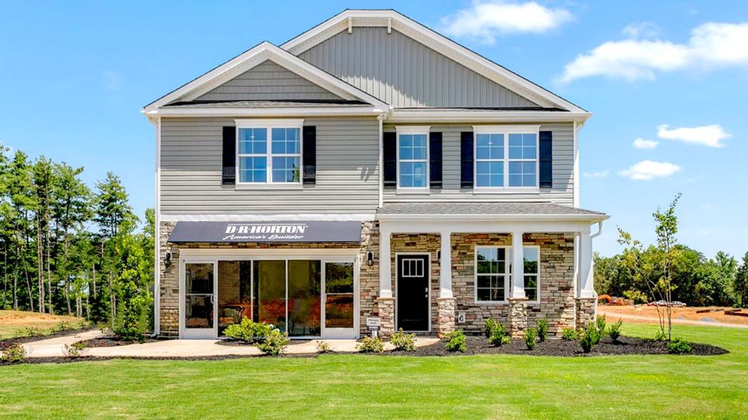 Front exterior of a home in the Colly Farm community, located in Stokesdale, NC (Image 2). Front exterior of a home in the Colly Farm community, located in Stokesdale, NC (Image 2).