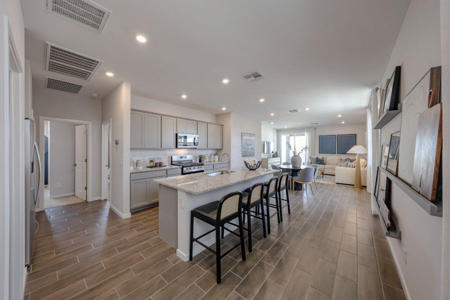 A kitchen with a dining table.