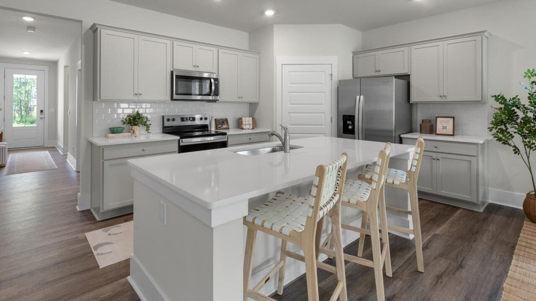 Furnished interior in a model home at The Grove at Blake Farm in Wilmington (Image 9).