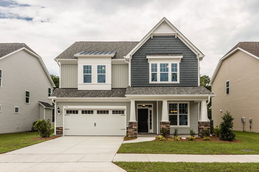 Front exterior of a home in the Melton Oaks - Robuck Homes community, located in Garner, NC (Image 6). Front exterior of a home in the Melton Oaks - Robuck Homes community, located in Garner, NC (Image 6).
