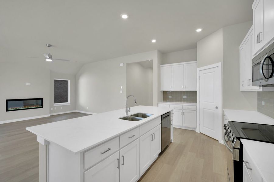 Furnished interior in a model home at South Meadow in Melissa (Image 4).