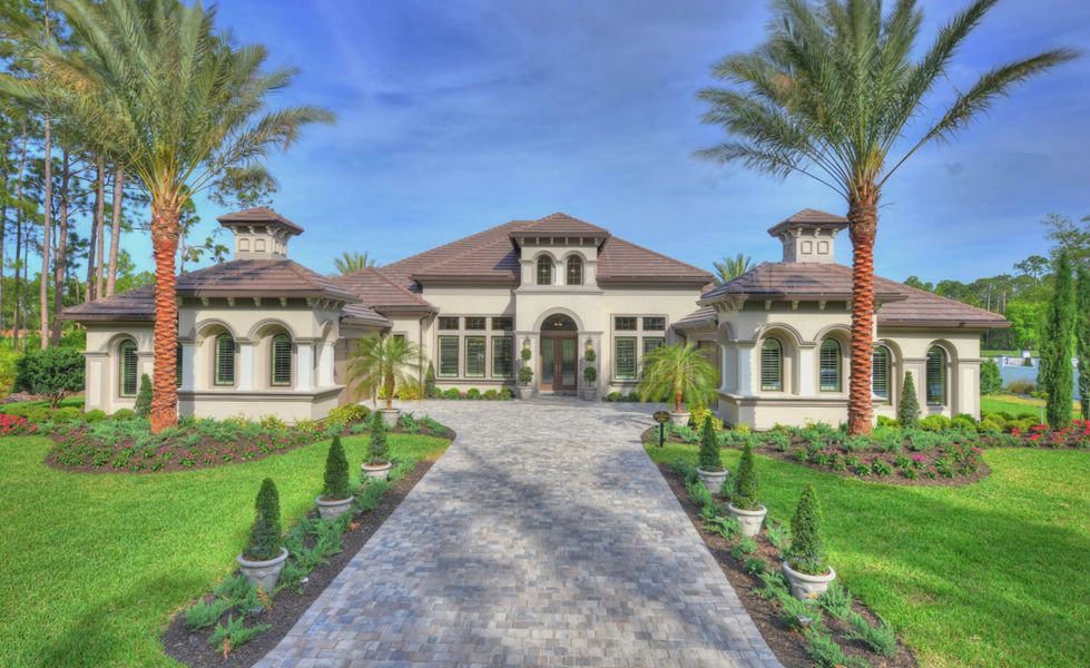 Front exterior of a home in the The Reserve at Plantation Bay community, located in Bunnell, FL (Image 2).