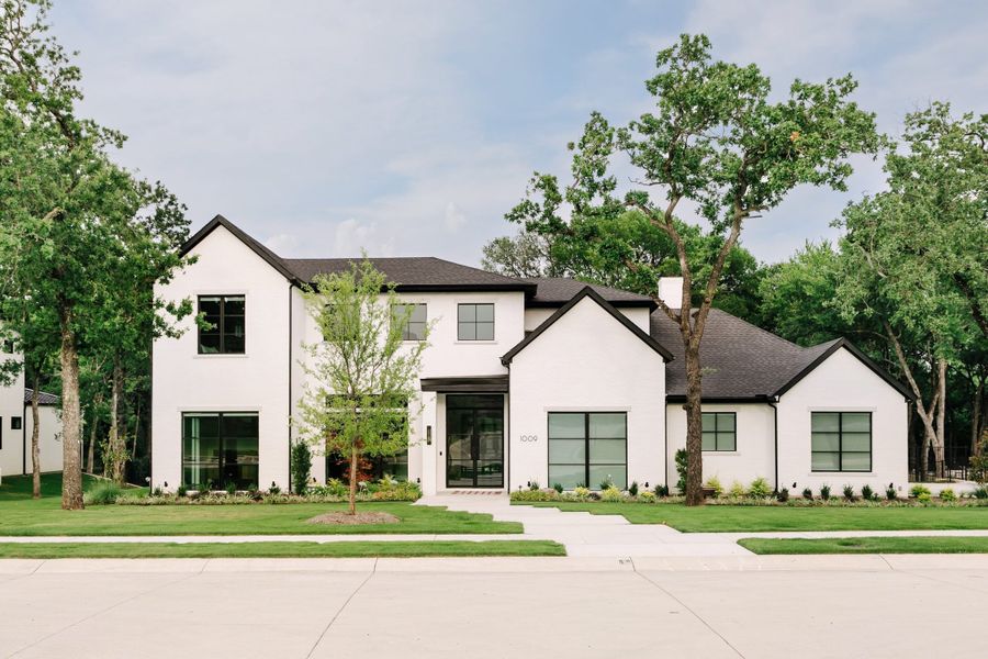 Front exterior of a home in the Villaggio community, located in Westlake, TX (Image 8). Front exterior of a home in the Villaggio community, located in Westlake, TX (Image 8).