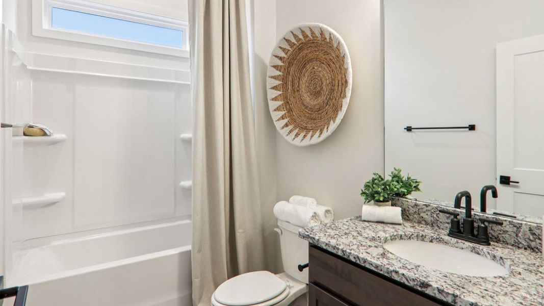 Furnished interior in a model home at Reserve at Tap Root Farms in Fletcher (Image 27).