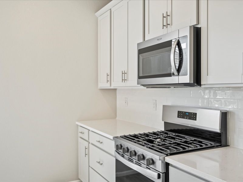 Furnished interior in a model home at Buffalo Highlands: The Flora Collection in Commerce City (Image 6).