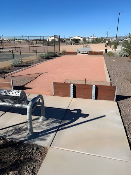 Recreational bocce courts in North Copper Canyon by Oakwood Homes Co, Surprise, AZ, surrounded by a serene desert landscape.
