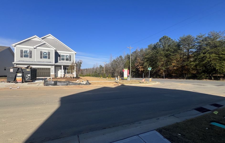A modern gray home under construction in Orchard Creek by Smith Douglas Homes (Charlotte, NC).