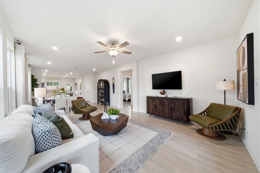 A living room with a large television.
