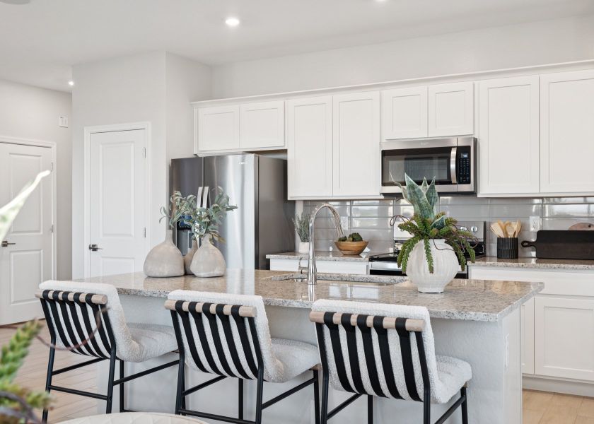 A kitchen with white cabinets. A kitchen with white cabinets.
