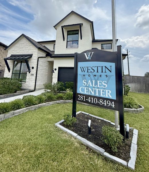 Charming white brick home with modern accents in Sienna - 45' by Westin Homes, located in Missouri City, TX.