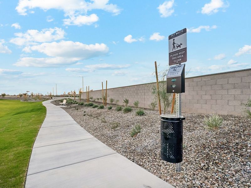 A sidewalk with signs on it. A sidewalk with signs on it.